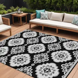 Photo of Black And Ivory Medallion Washable Indoor Outdoor Area Rug