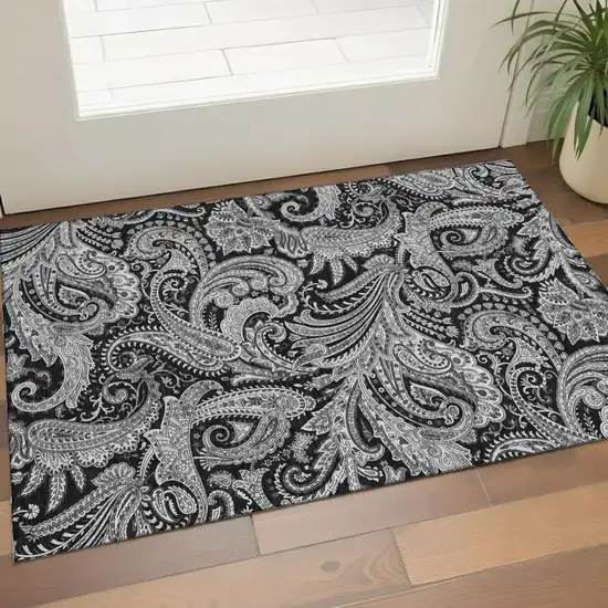 Black And Ivory Paisley Washable Area Rug With UV Protection Photo 1