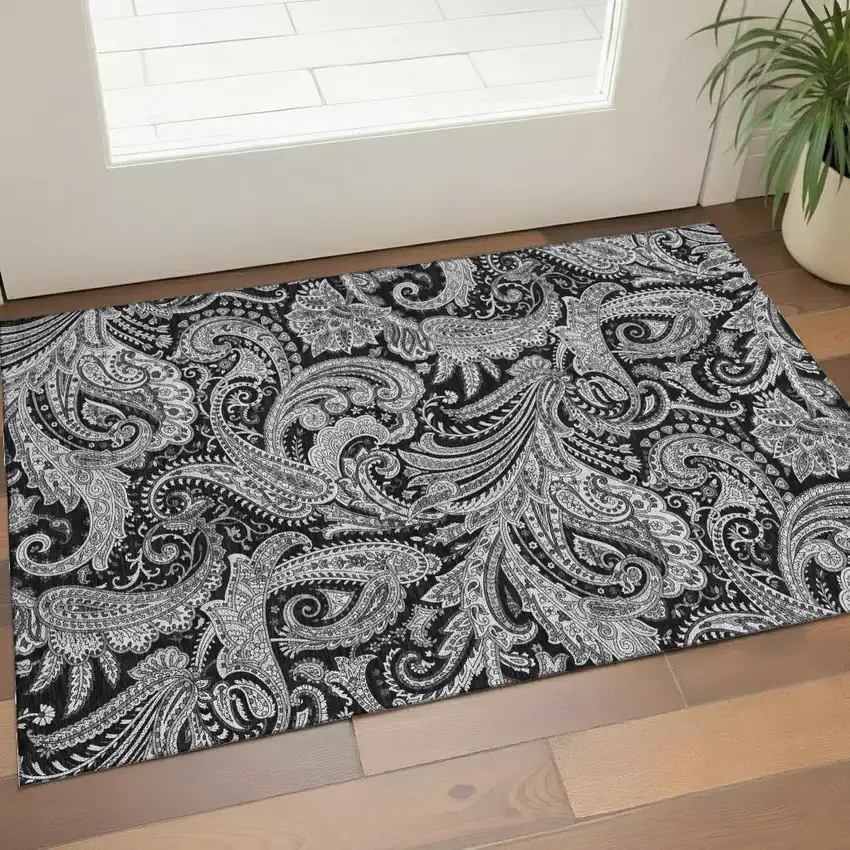 Black And Ivory Paisley Washable Area Rug With UV Protection Photo 1