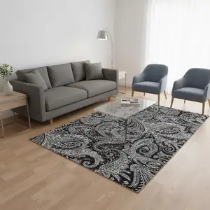 Photo of Black And Ivory Paisley Washable Area Rug With UV Protection