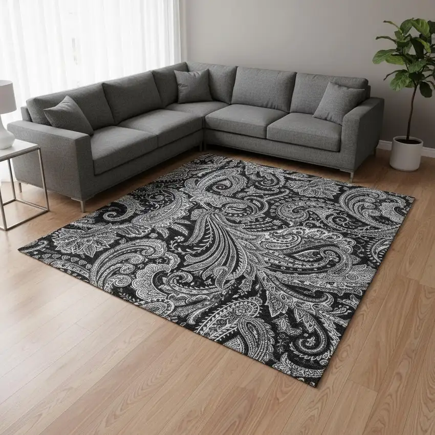 Black And Ivory Paisley Washable Area Rug With UV Protection Photo 1