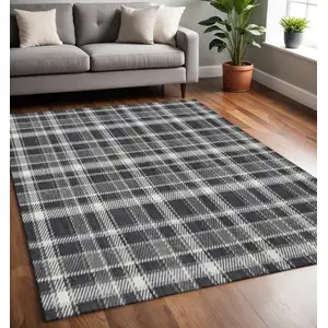 Photo of Black And Ivory Plaid Washable Area Rug With UV Protection