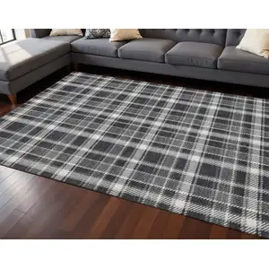 Photo of Black And Ivory Plaid Washable Area Rug With UV Protection