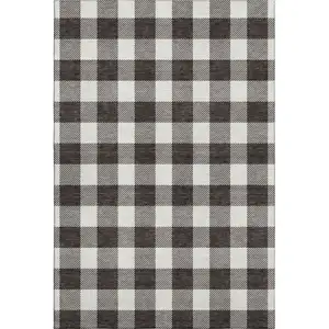 Photo of Black And Ivory Plaid Washable Area Rug With UV Protection