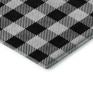 Photo of Black And Ivory Plaid Washable Area Rug With UV Protection