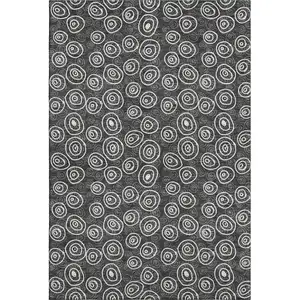 Photo of Black And Ivory Polka Dot Washable Area Rug With UV Protection