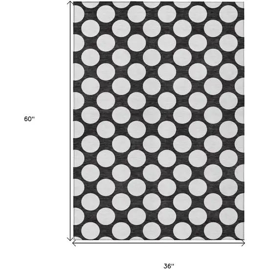 Black And Ivory Polka Dot Washable Indoor Outdoor Area Rug Photo 3