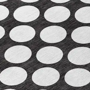 Photo of Black And Ivory Polka Dot Washable Indoor Outdoor Area Rug