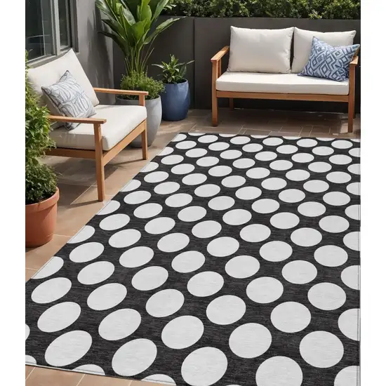 Black And Ivory Polka Dot Washable Indoor Outdoor Area Rug Photo 1