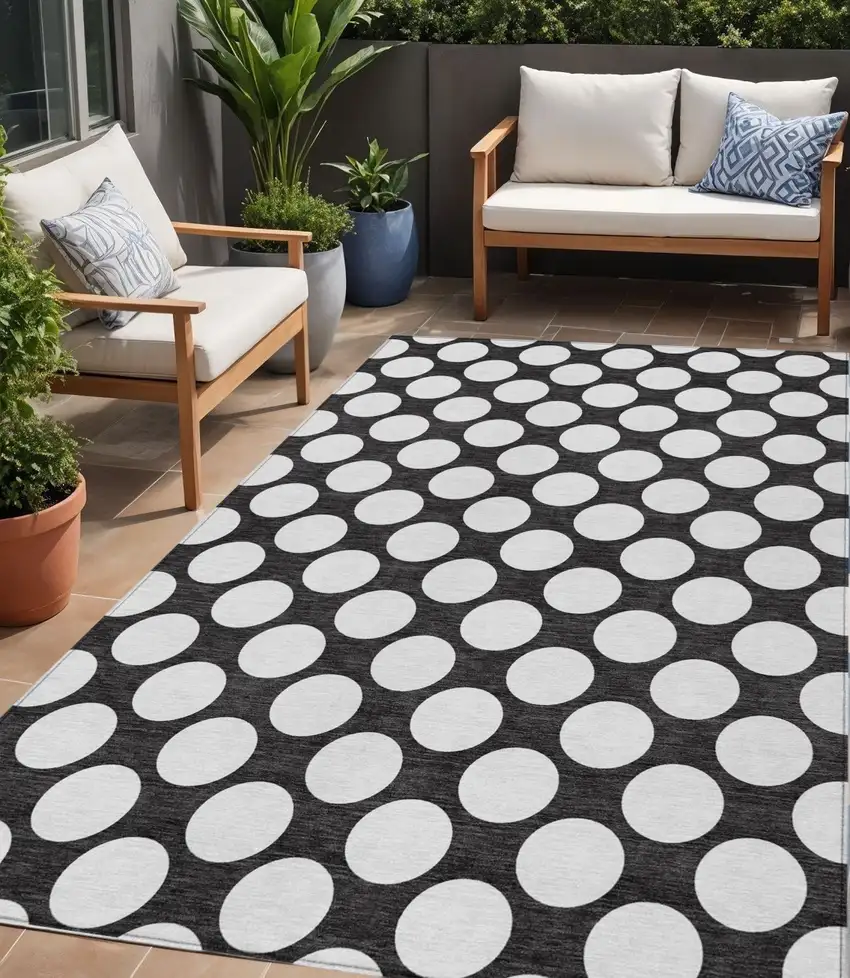 Black And Ivory Polka Dot Washable Indoor Outdoor Area Rug Photo 1