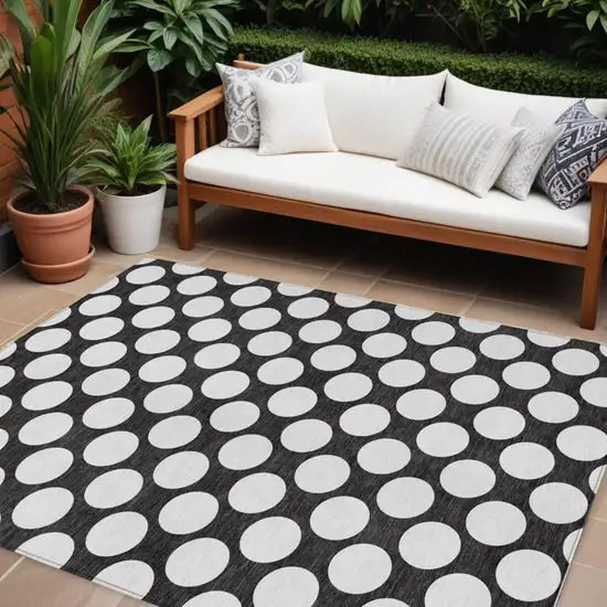 Black And Ivory Polka Dot Washable Indoor Outdoor Area Rug Photo 1
