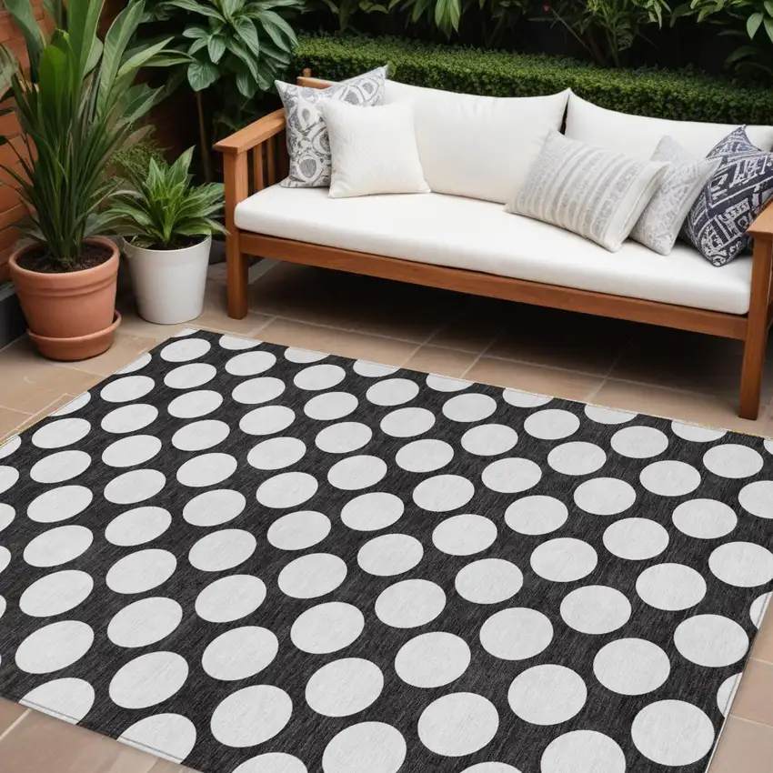 Black And Ivory Polka Dot Washable Indoor Outdoor Area Rug Photo 1