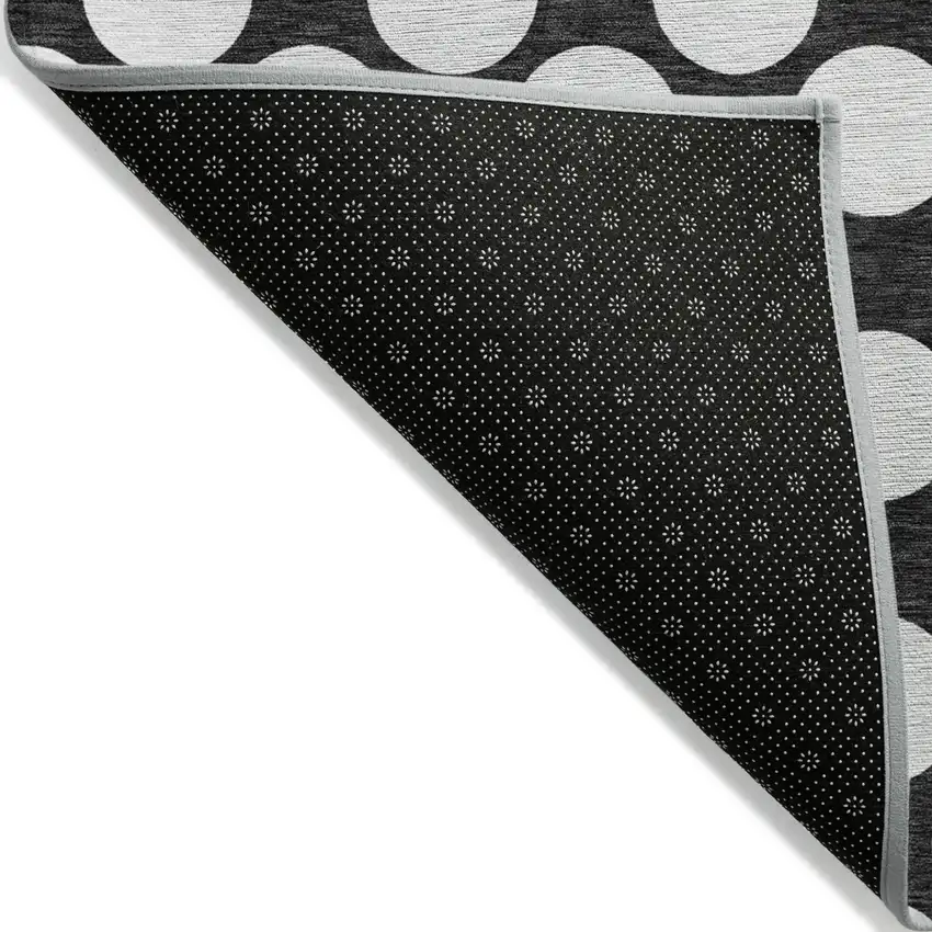 Black And Ivory Polka Dot Washable Indoor Outdoor Area Rug Photo 4