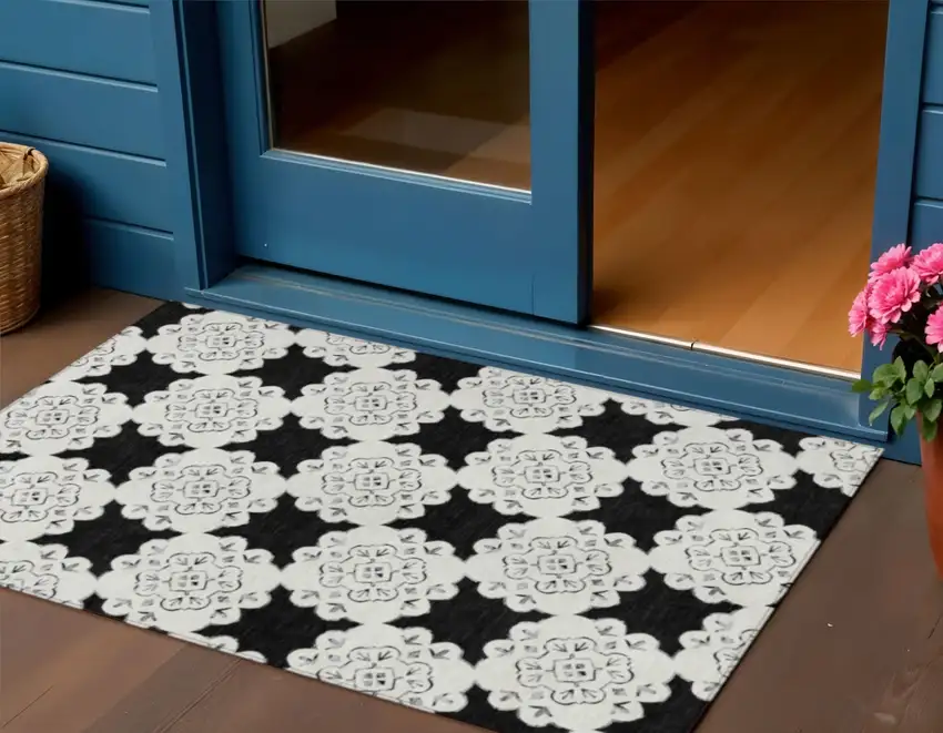 Black And Ivory Quatrefoil Washable Indoor Outdoor Area Rug Photo 1