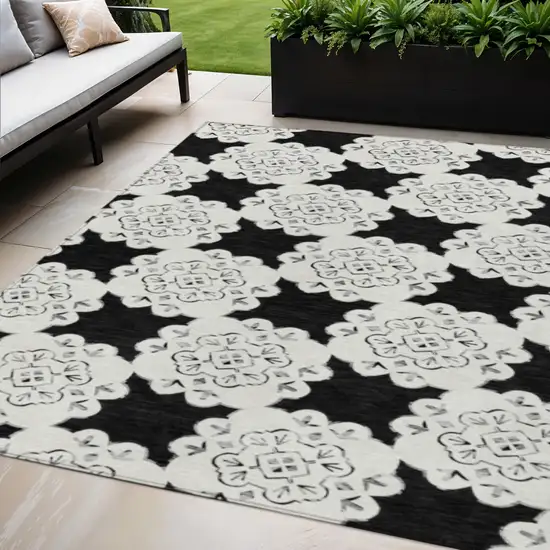 Black And Ivory Quatrefoil Washable Indoor Outdoor Area Rug Photo 1