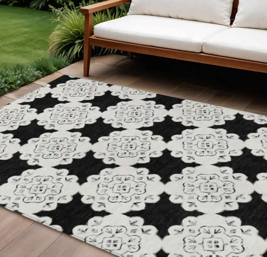 Black And Ivory Quatrefoil Washable Indoor Outdoor Area Rug Photo 1