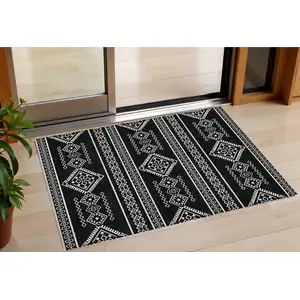 Photo of Black And Ivory Southwestern Washable Indoor Outdoor Area Rug