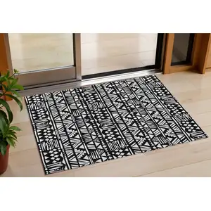 Photo of Black And Ivory Southwestern Washable Indoor Outdoor Area Rug