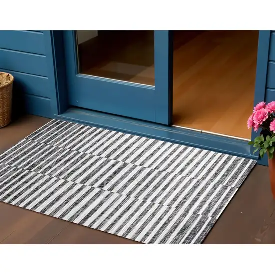 Black And Ivory Striped Indoor Outdoor Area Rug Photo 1