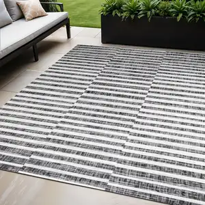 Photo of Black And Ivory Striped Indoor Outdoor Area Rug