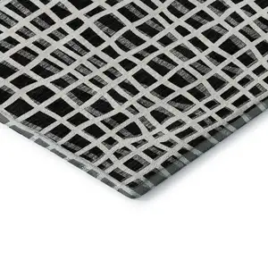 Photo of Black And Ivory Striped Washable Area Rug With UV Protection