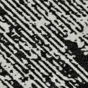 Photo of Black And Ivory Striped Washable Area Rug With UV Protection