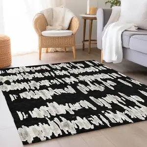 Photo of Black And Ivory Striped Washable Area Rug With UV Protection