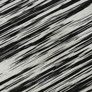Photo of Black And Ivory Striped Washable Area Rug With UV Protection