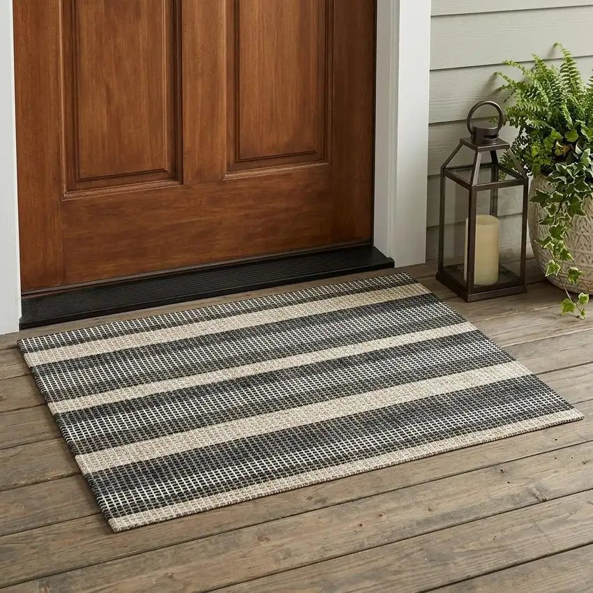 Black And Ivory Striped Washable Indoor Outdoor Area Rug Photo 1