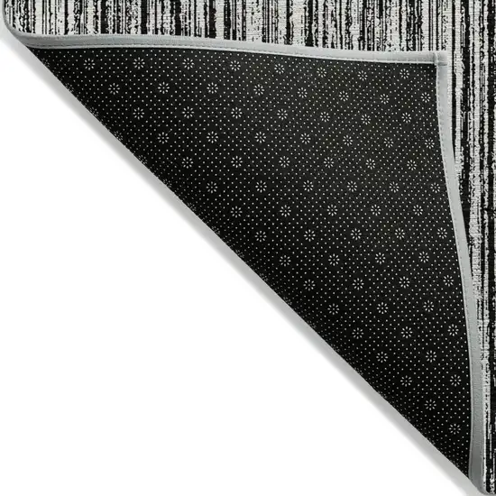 Black And Ivory Striped Washable Indoor Outdoor Area Rug Photo 3