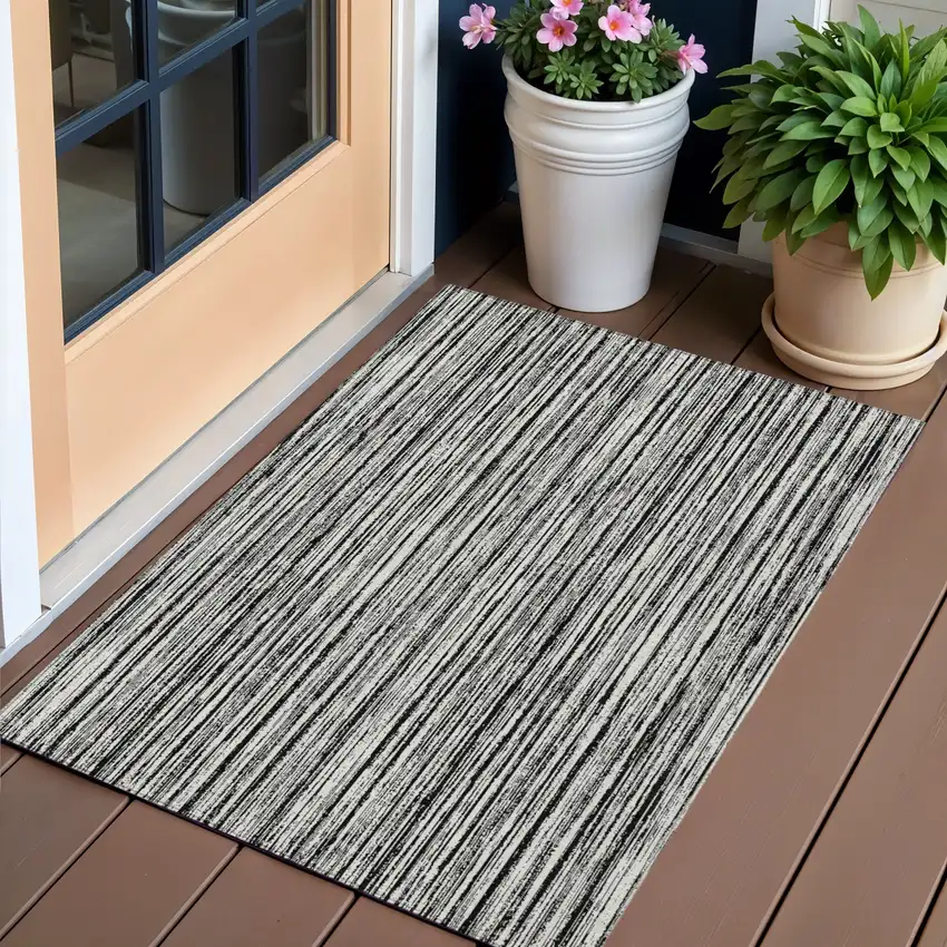 Black And Ivory Striped Washable Indoor Outdoor Area Rug Photo 1