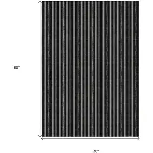 Photo of Black And Ivory Striped Washable Indoor Outdoor Area Rug