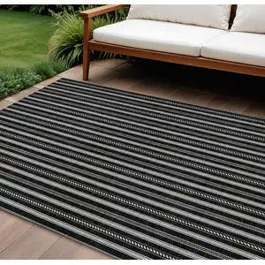 Photo of Black And Ivory Striped Washable Indoor Outdoor Area Rug