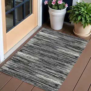 Photo of Black And Ivory Striped Washable Indoor Outdoor Area Rug