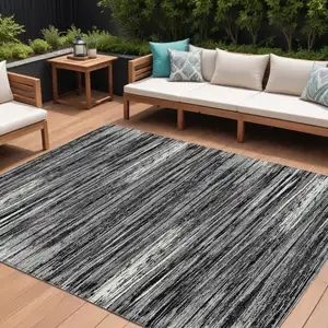 Photo of Black And Ivory Striped Washable Indoor Outdoor Area Rug