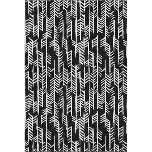 Photo of Black And Ivory Tribal Washable Area Rug With UV Protection
