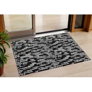 Photo of Black And Ivory Tribal Washable Indoor Outdoor Area Rug