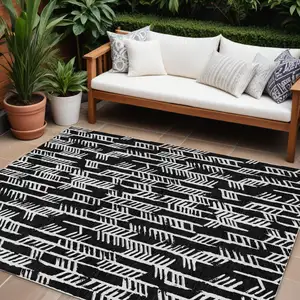 Photo of Black And Ivory Tribal Washable Indoor Outdoor Area Rug