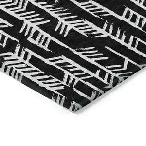 Photo of Black And Ivory Tribal Washable Indoor Outdoor Area Rug