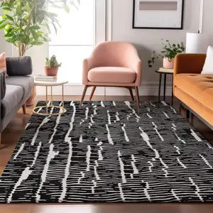 Photo of Black And Ivory Vermicular Washable Area Rug With UV Protection