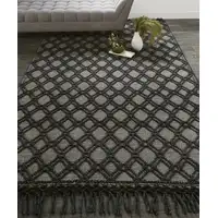 Photo of Black And Ivory Wool Geometric Hand Woven Area Rug With Fringe