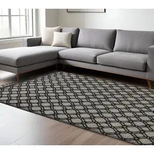 Photo of Black And Ivory Wool Geometric Hand Woven Area Rug With Fringe