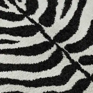 Photo of Black And Ivory Zebra Print Washable Indoor Outdoor Area Rug