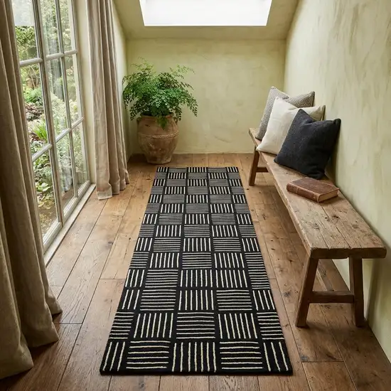 6' Black and Off White Abstract Machine Tufted Washable Runner Rug With UV Protection Photo 1