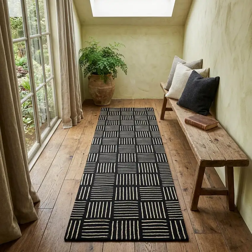 6' Black and Off White Abstract Machine Tufted Washable Runner Rug With UV Protection Photo 1