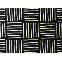 Photo of Black And Off White Abstract Machine Washable Area Rug With UV Protection