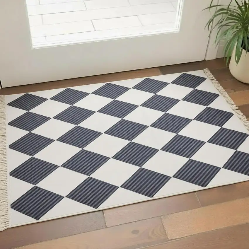 Black And Off White Geometric Washable Area Rug With Fringe Photo 1