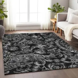 Photo of Black And Silver Paisley Washable Area Rug With UV Protection