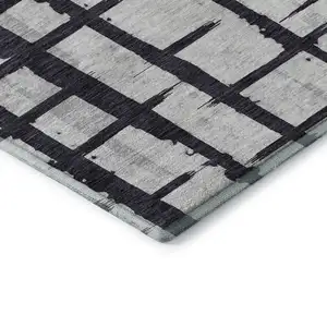 Photo of Black And Silver Striped Washable Area Rug With UV Protection