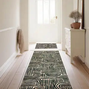 Photo of Black And Tan Tribal Washable Area Rug With UV Protection